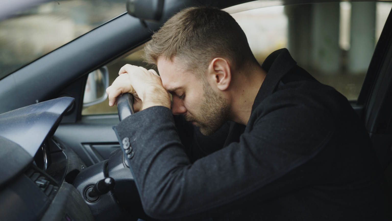 Man distressed inside a car